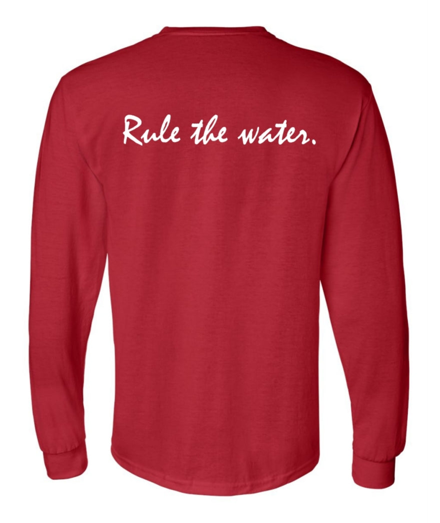 Back of a long sleeved red shirt, with white letters, text on the shirt: Rule the water.